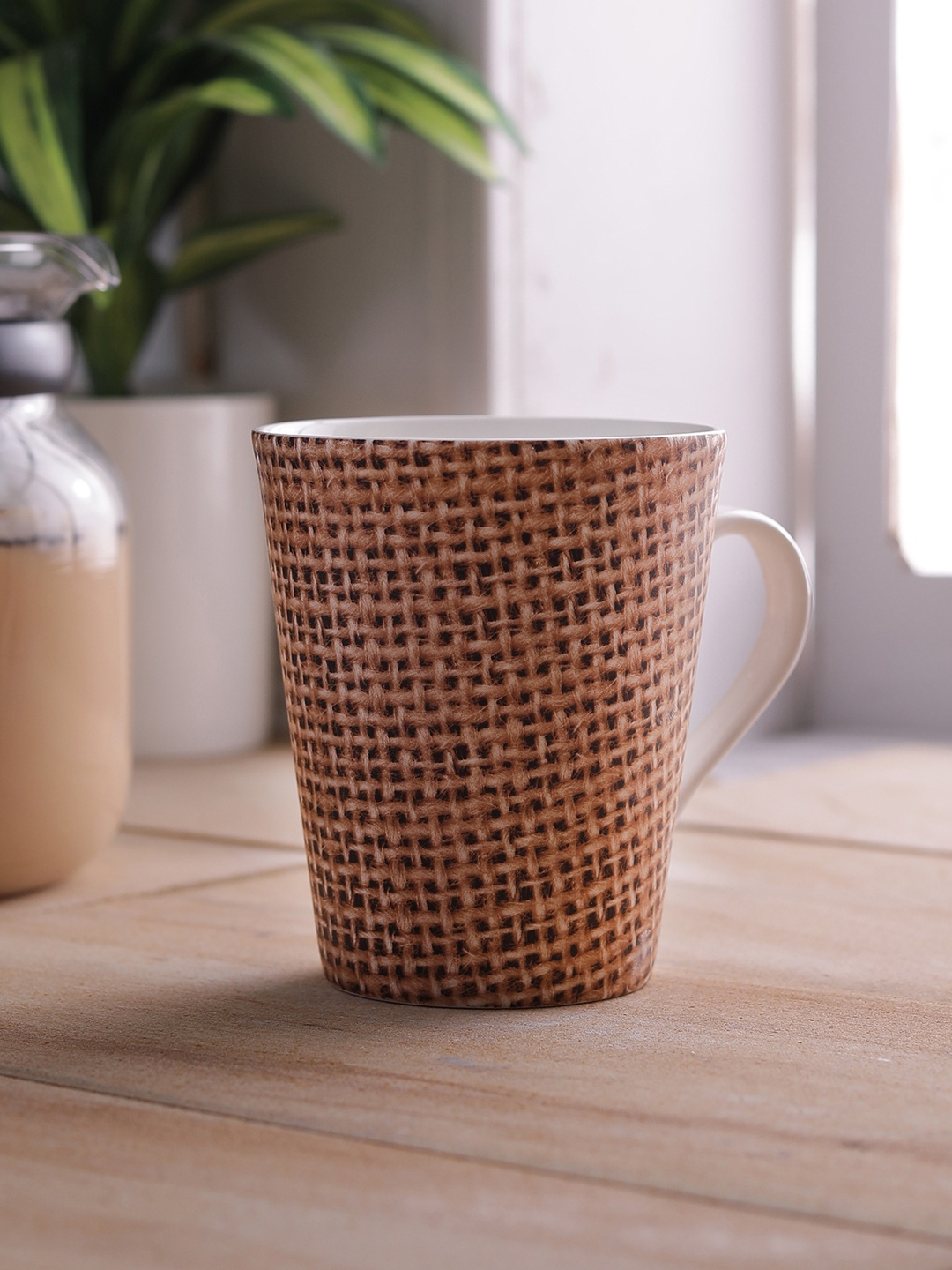 

CLAY CRAFT Brown & White 4-Pieces Printed Bone China Cups Set