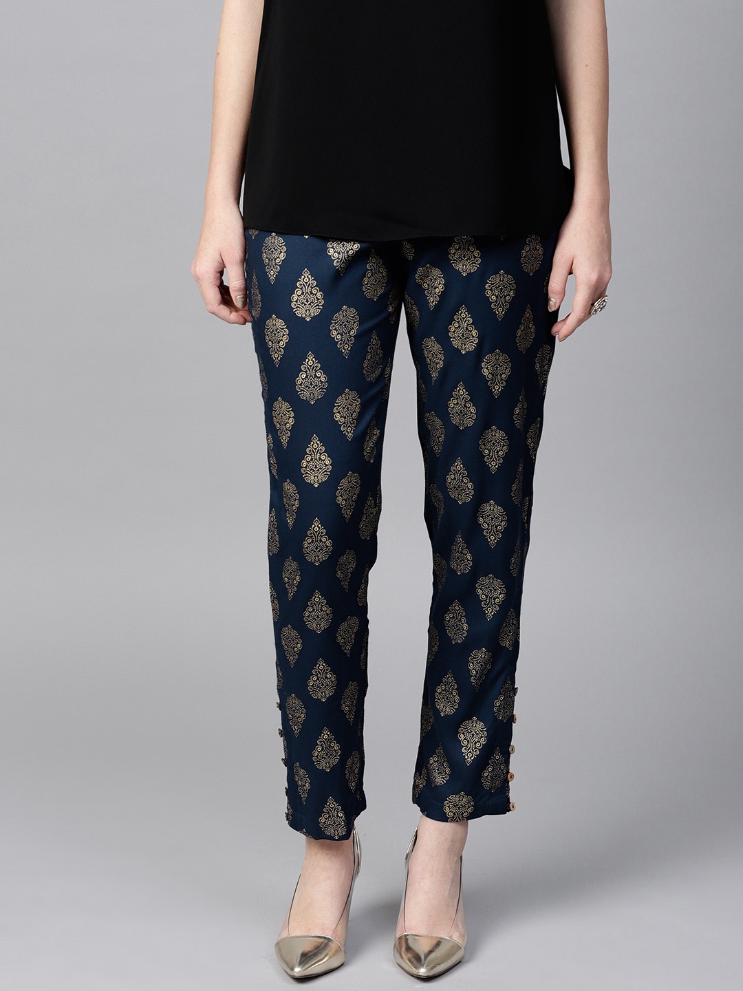 

SASSAFRAS Women Navy Blue & Golden Tapered Fit Printed Trousers
