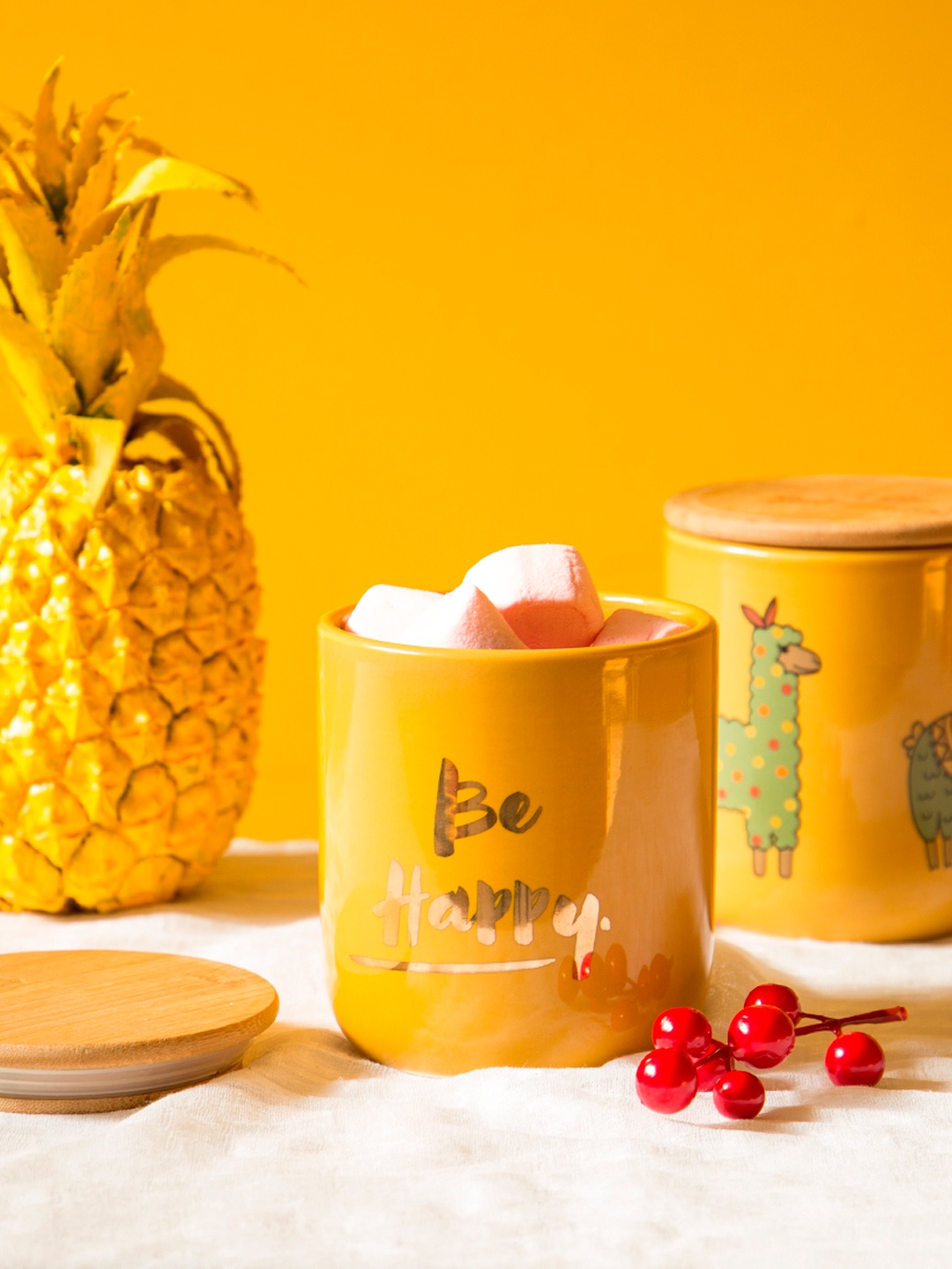 

Chumbak Yellow Printed Storage Jar With Lid