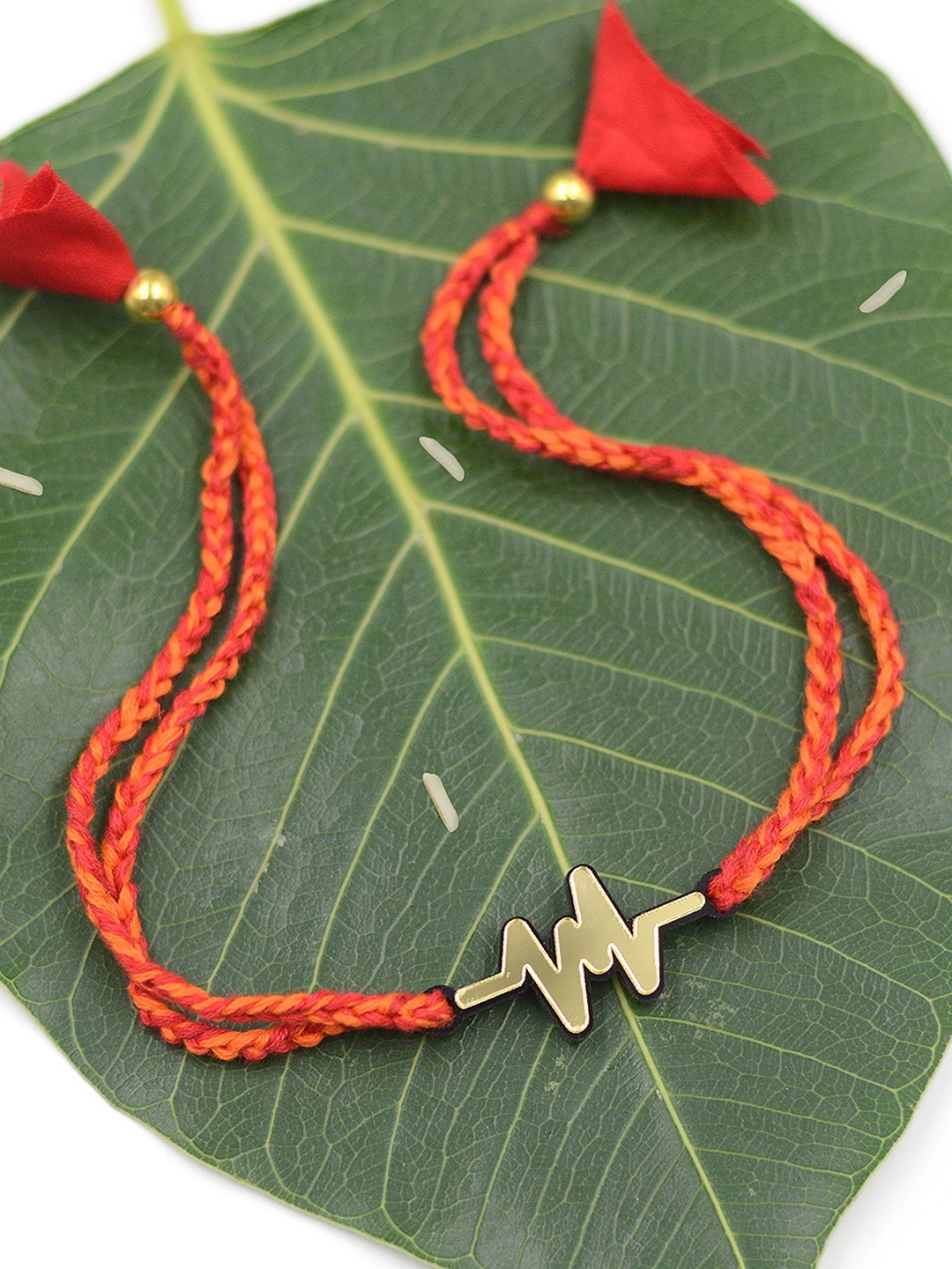 

Krafted with Happiness Gold-Toned Plastic My Heartbeat Handcrafted Rakhi