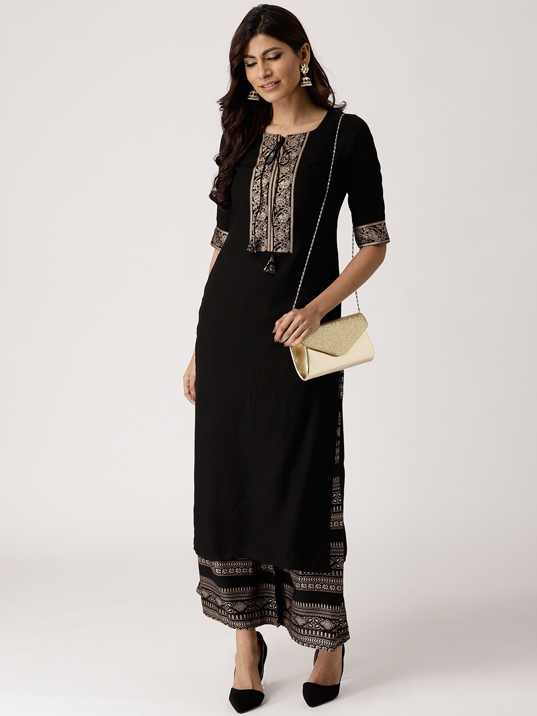 

Libas Women Black & Golden Solid Kurta with Palazzos