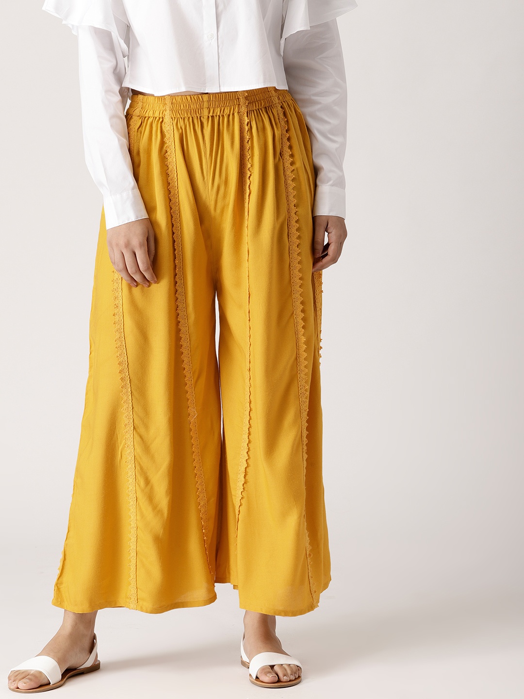 

Libas Women Mustard Yellow Solid Flared Palazzos