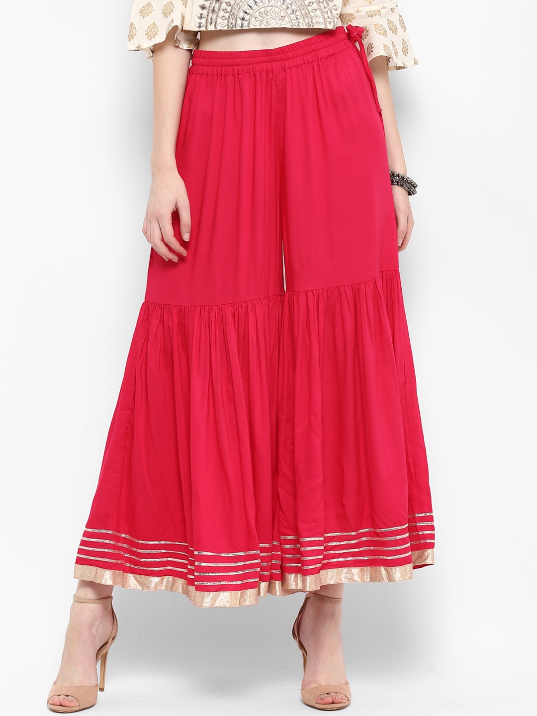 

Varanga Women Pink Solid Flared Palazzos