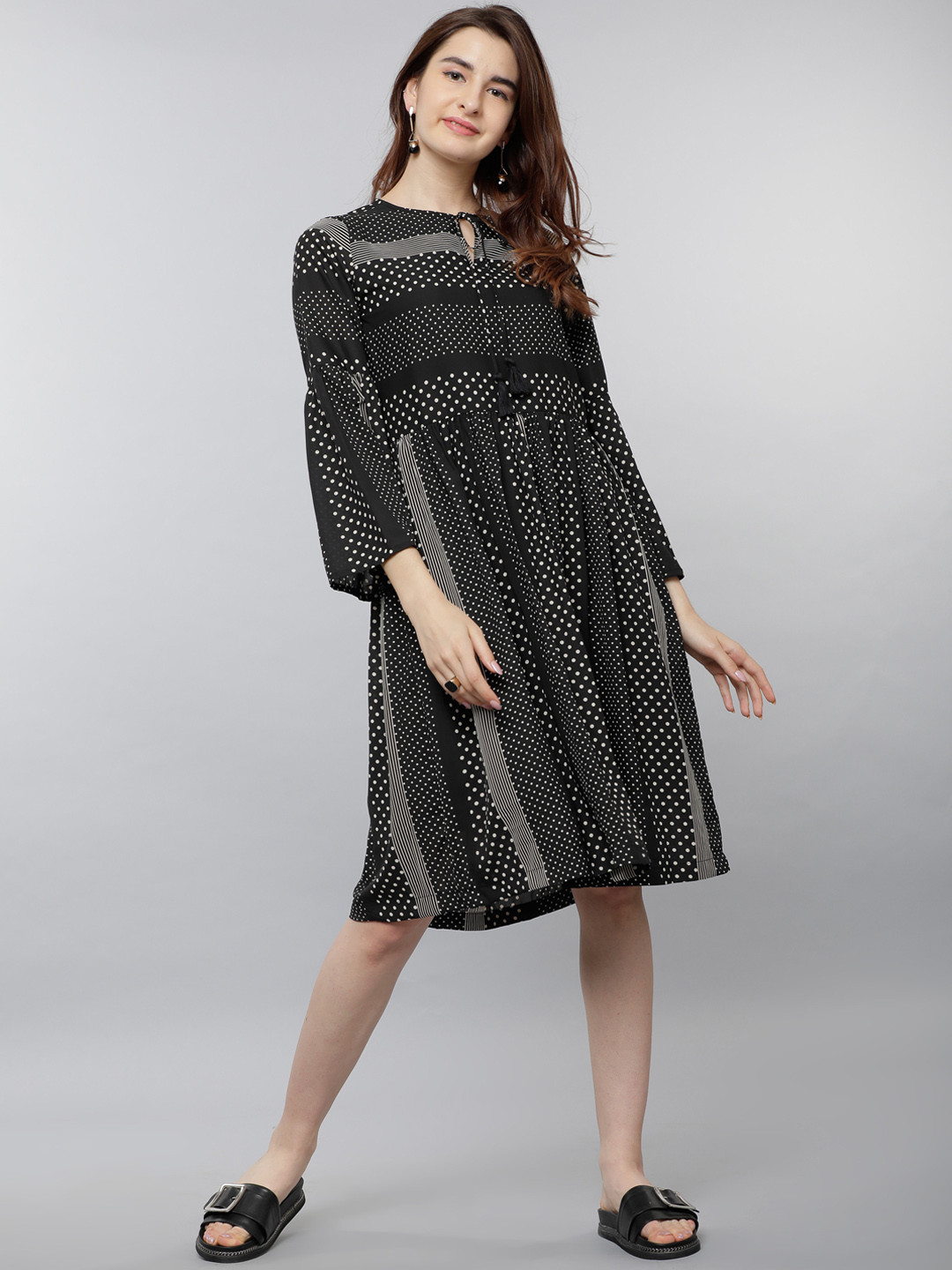 

Tokyo Talkies Women Black Printed Fit and Flare Dress