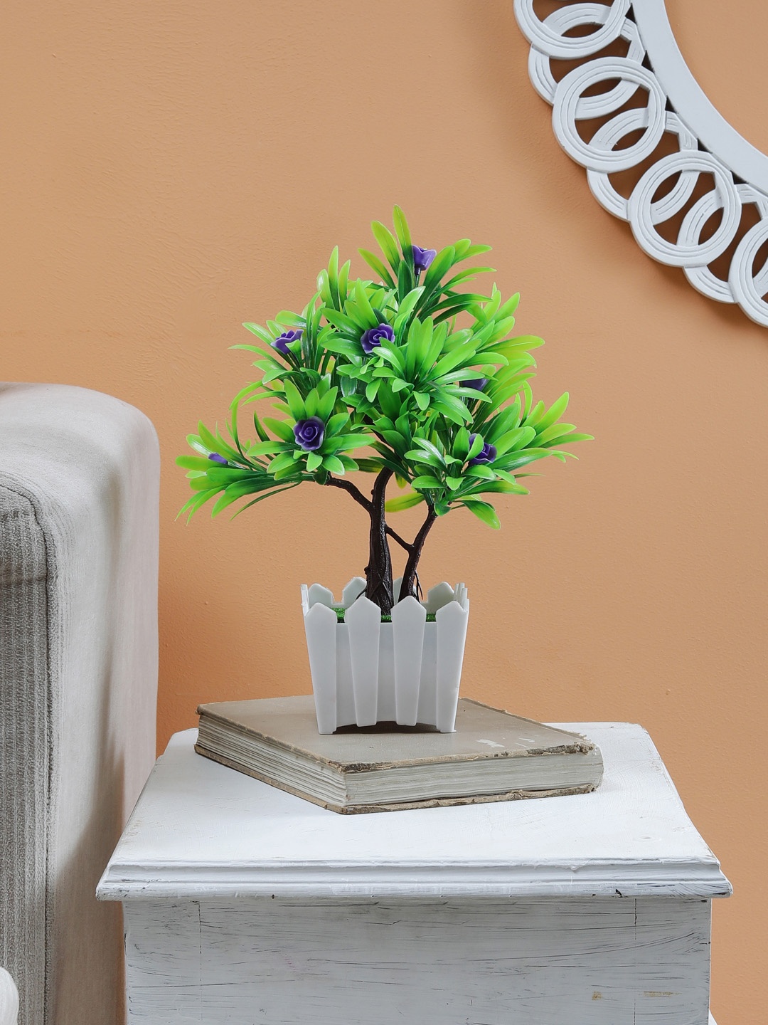 

Foliyaj S Shaped Bonsai Tree With Green Leaves and Small Purple Flowers in Brown Pot