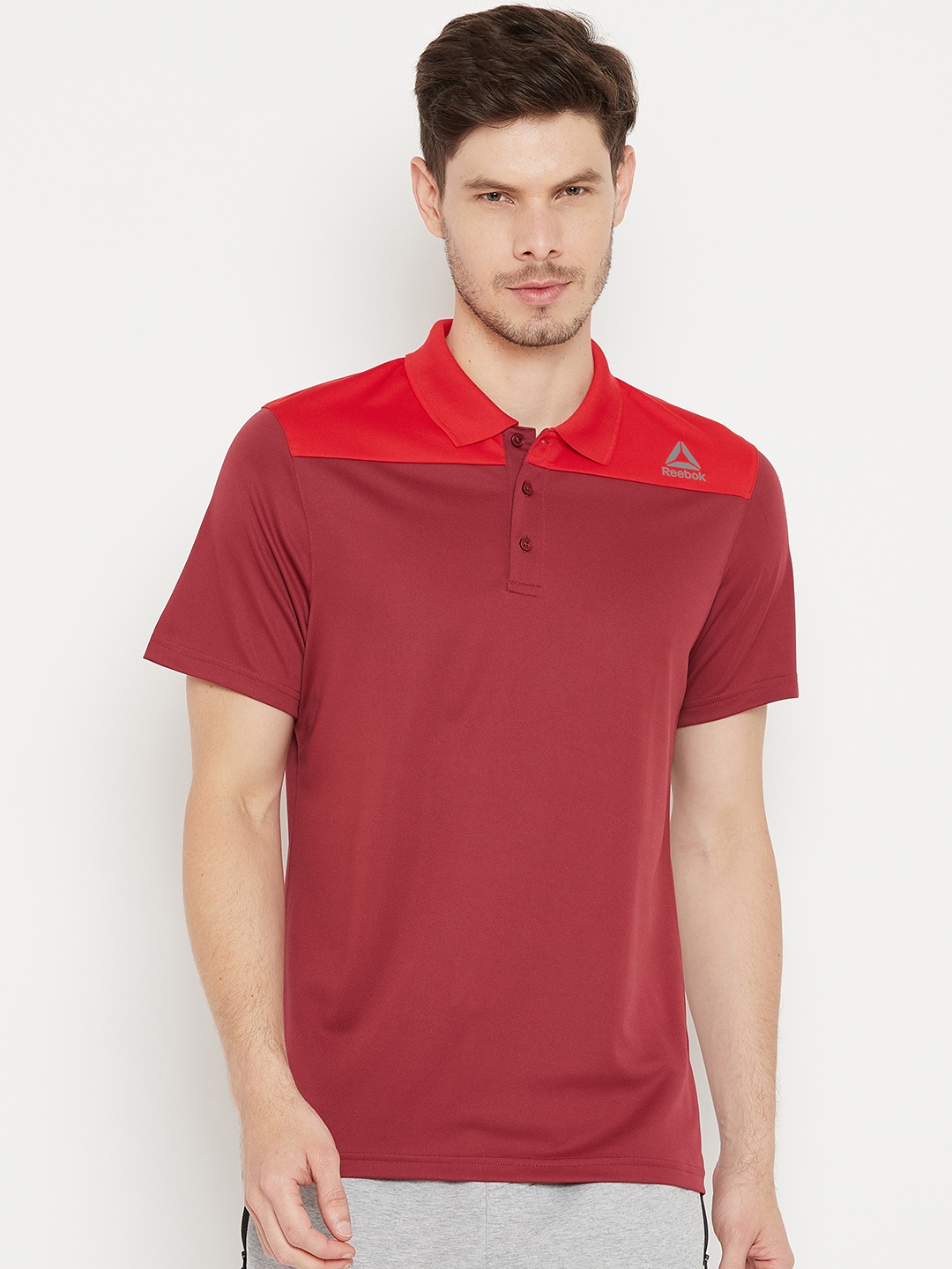 

Reebok Men Maroon & Orange Colourblocked Yoke Polo Collar T-shirt
