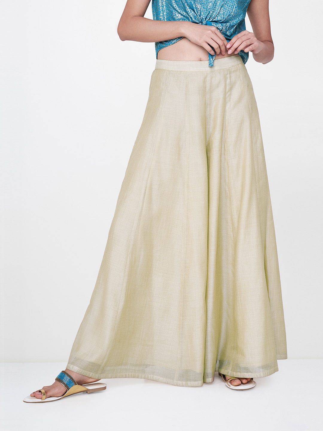 

Global Desi Women Beige Solid Flared Palazzos