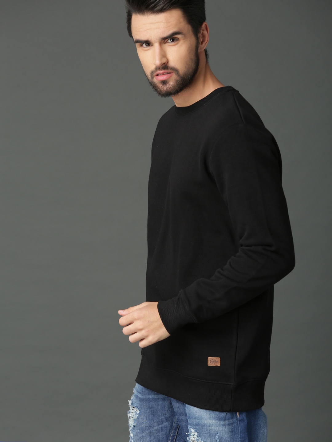 

Roadster Men Black Solid Sweatshirt