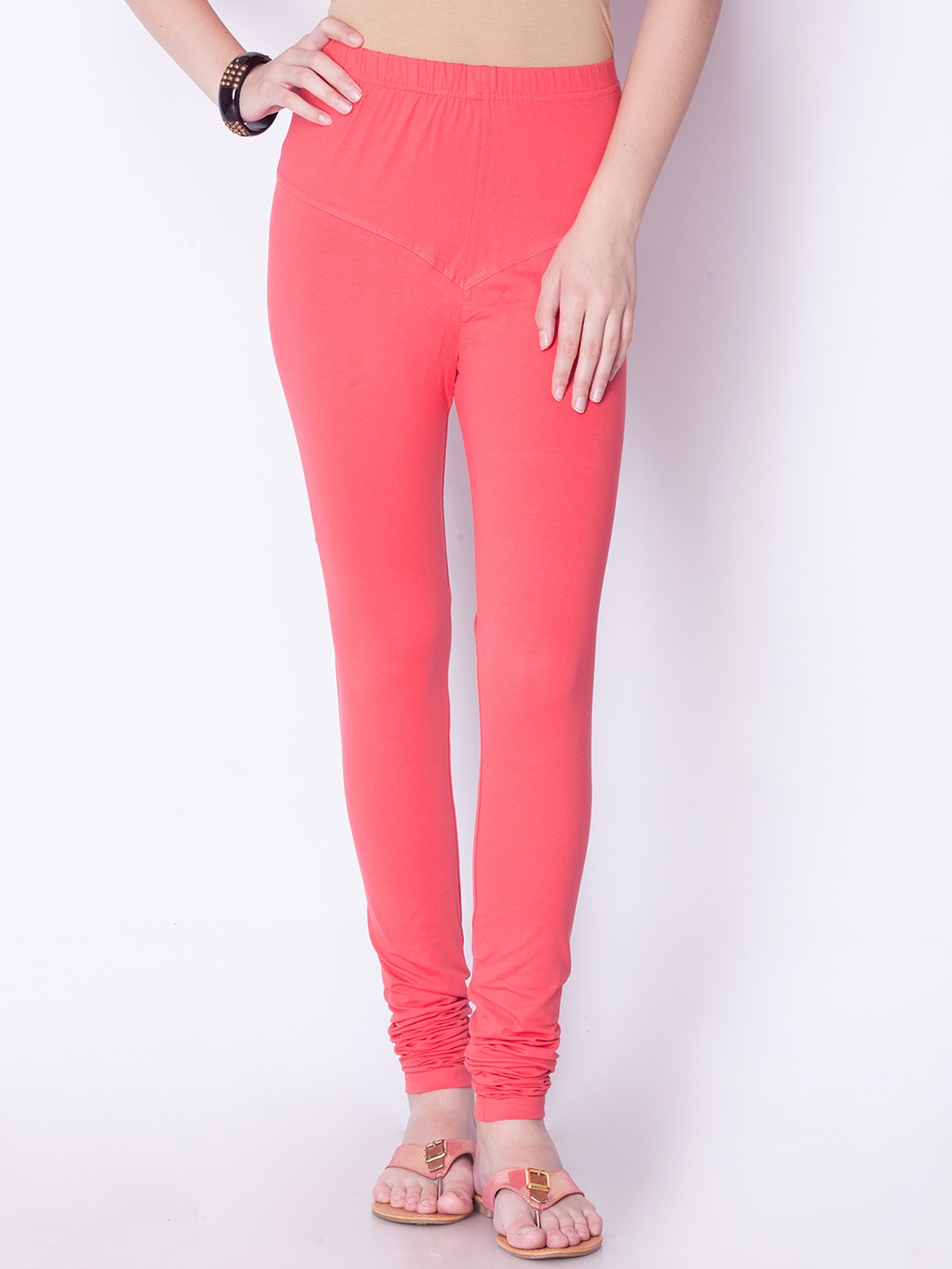 

Dollar Missy Women Peach-Coloured Solid Churidar Leggings