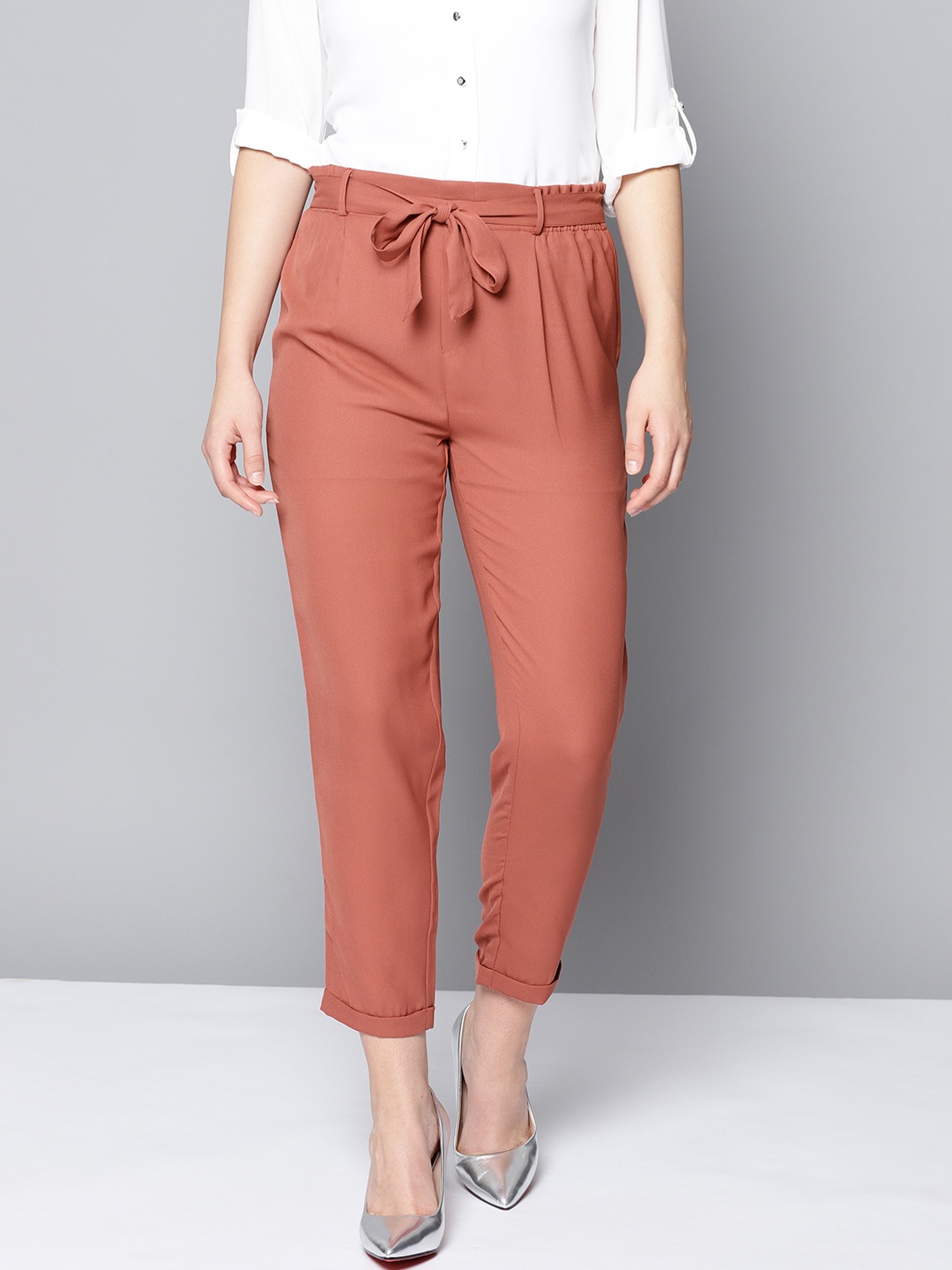 

Besiva Women Rust Orange Loose Fit Belted Peg Trousers