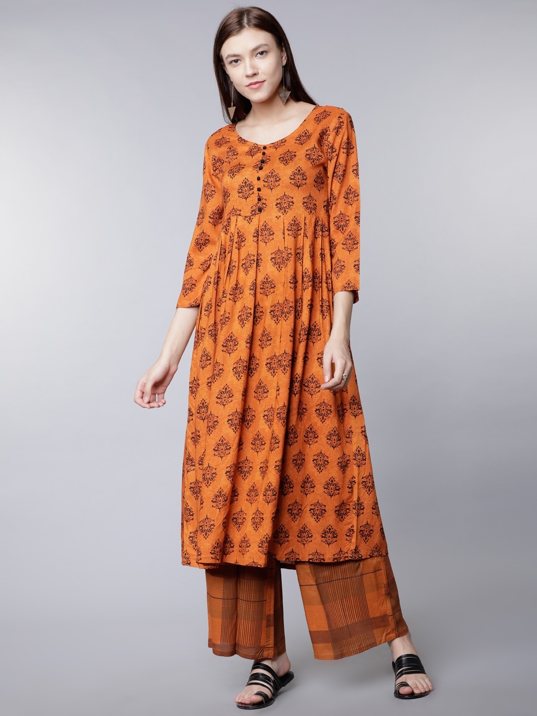 

Vishudh Women Rust Red Printed Kurta with Palazzos