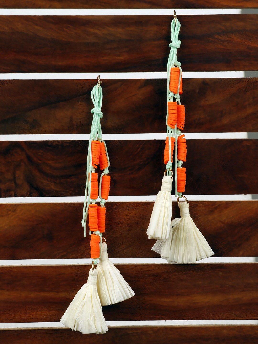 

PRITA BY PRIYAASI Orange & Off-White Tasseled Contemporary Drop Earrings