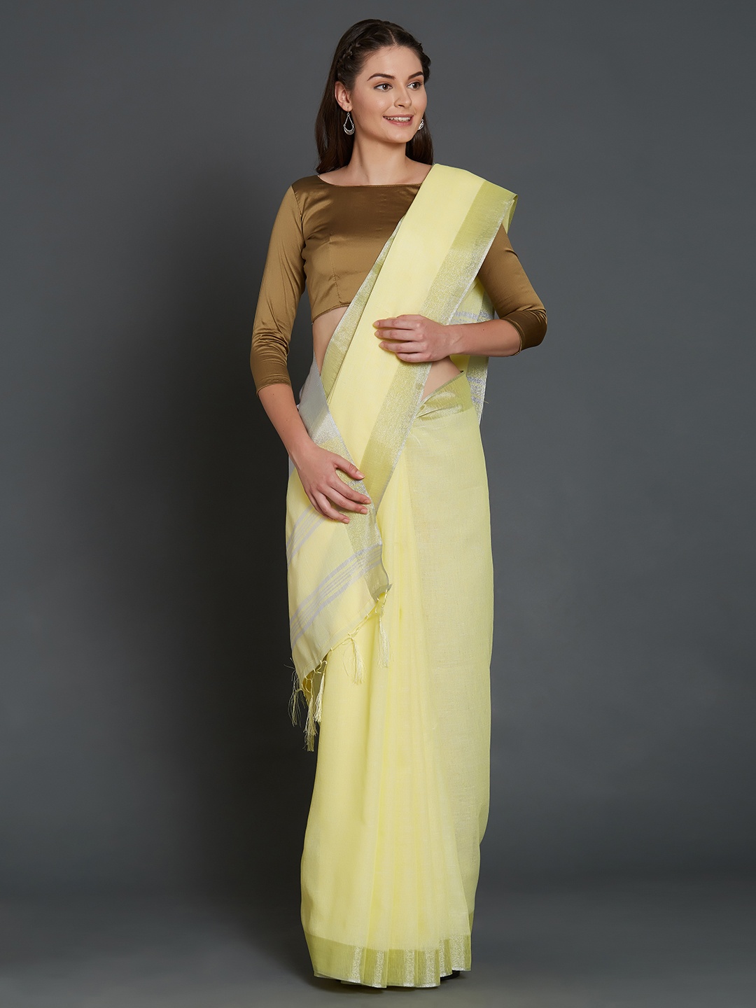 

Mitera Yellow & Silver-Coloured Silk Cotton Solid Saree