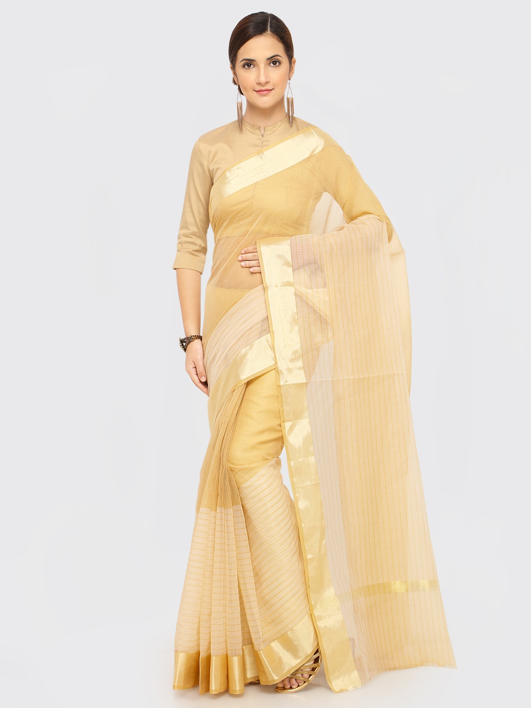 

Rajnandini Beige Solid Kota Saree