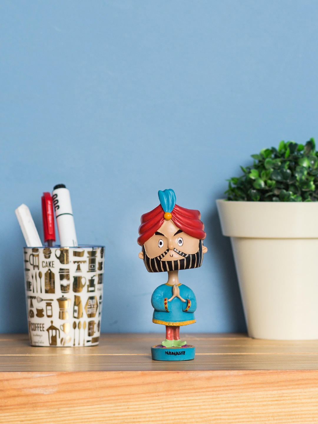 

Chumbak Blue & Multicoloured Bobby Bobblehead Showpiece