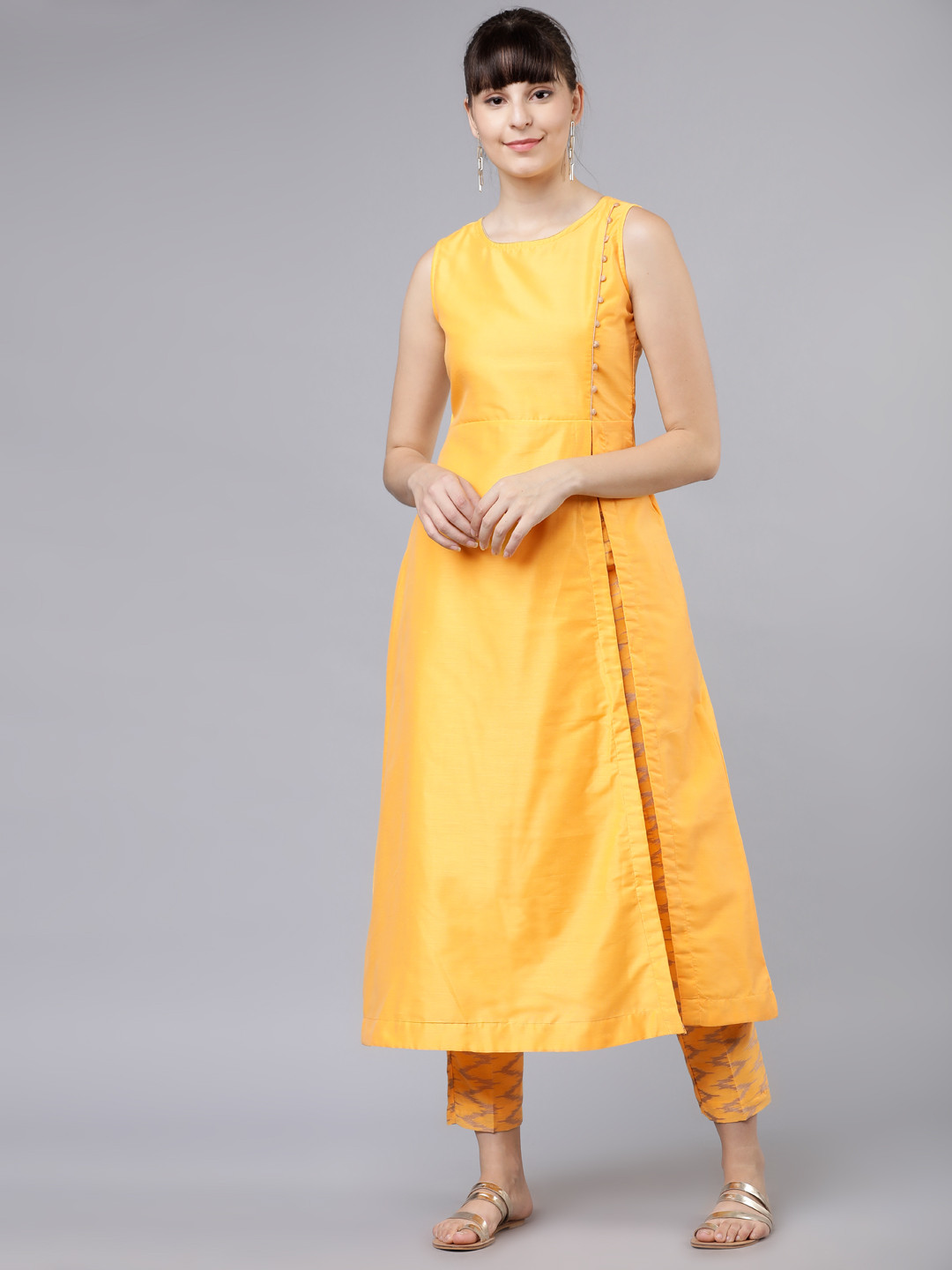 

Vishudh Women Yellow Solid Kurta with Trousers