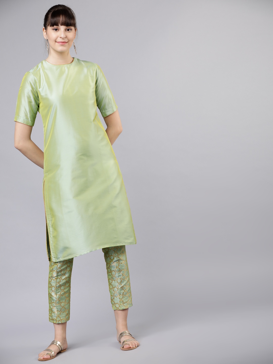 

Vishudh Women Green Solid Kurta with Trousers