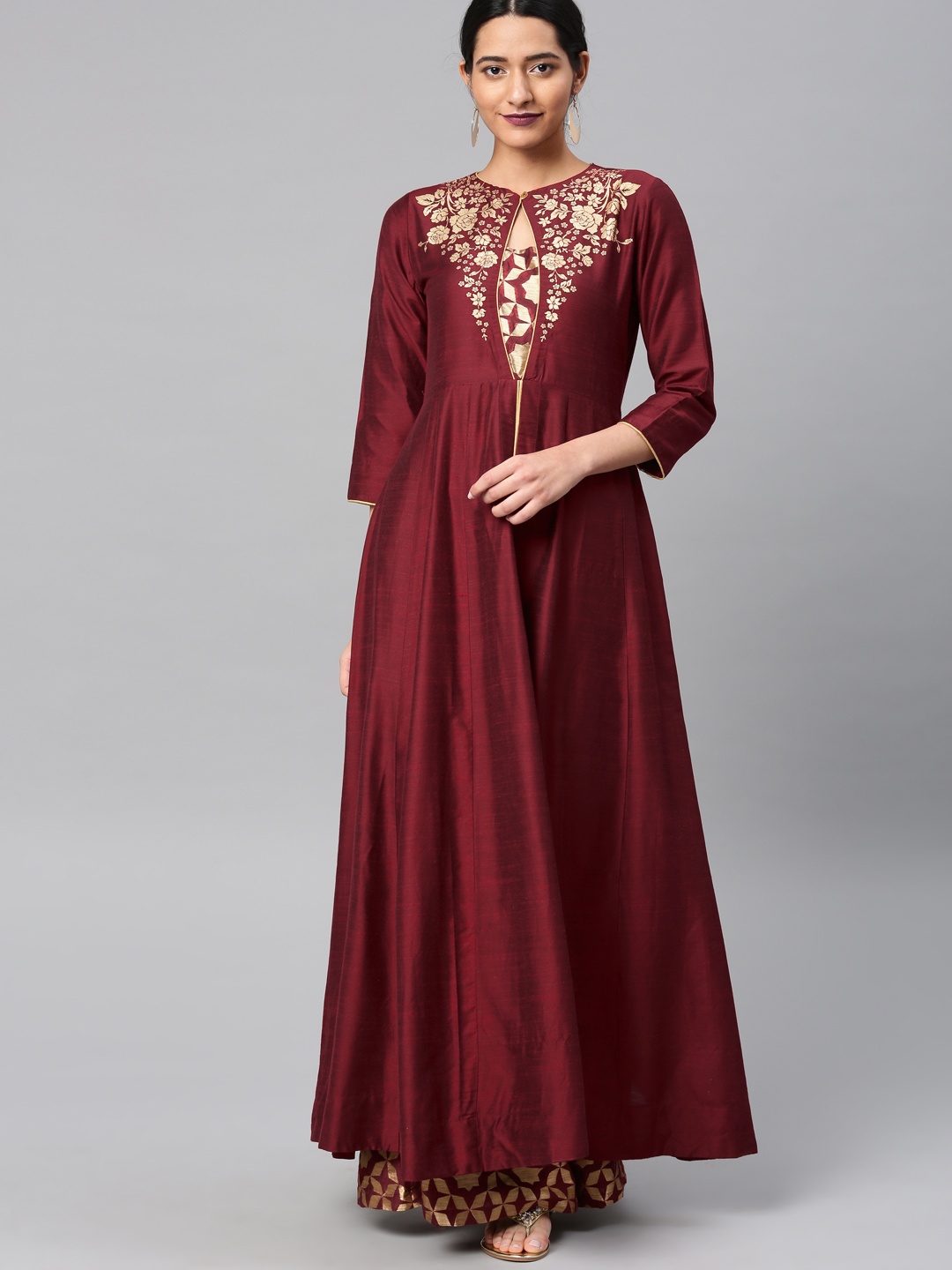 

Vishudh Women Maroon Solid Kurta with Palazzos