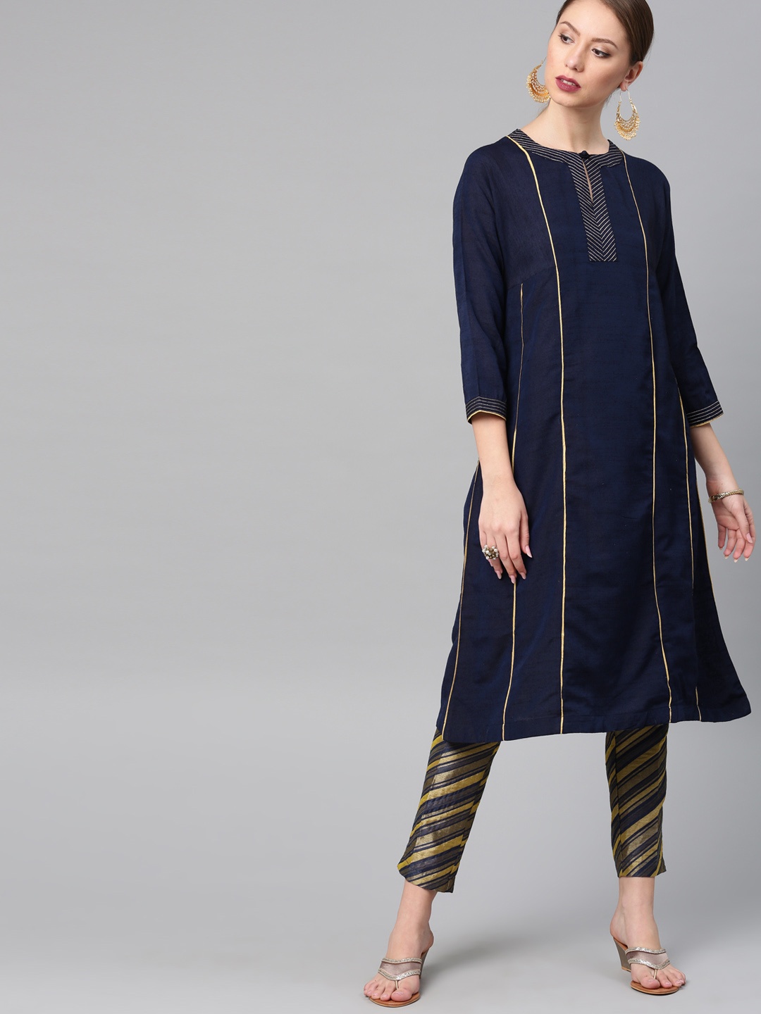 

Vishudh Women Navy Blue & Gold-Toned Solid Kurta with Palazzos