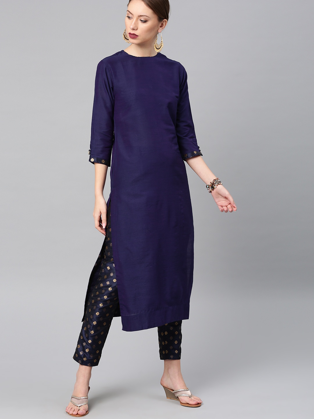 

Vishudh Women Purple Solid Kurta with Trousers