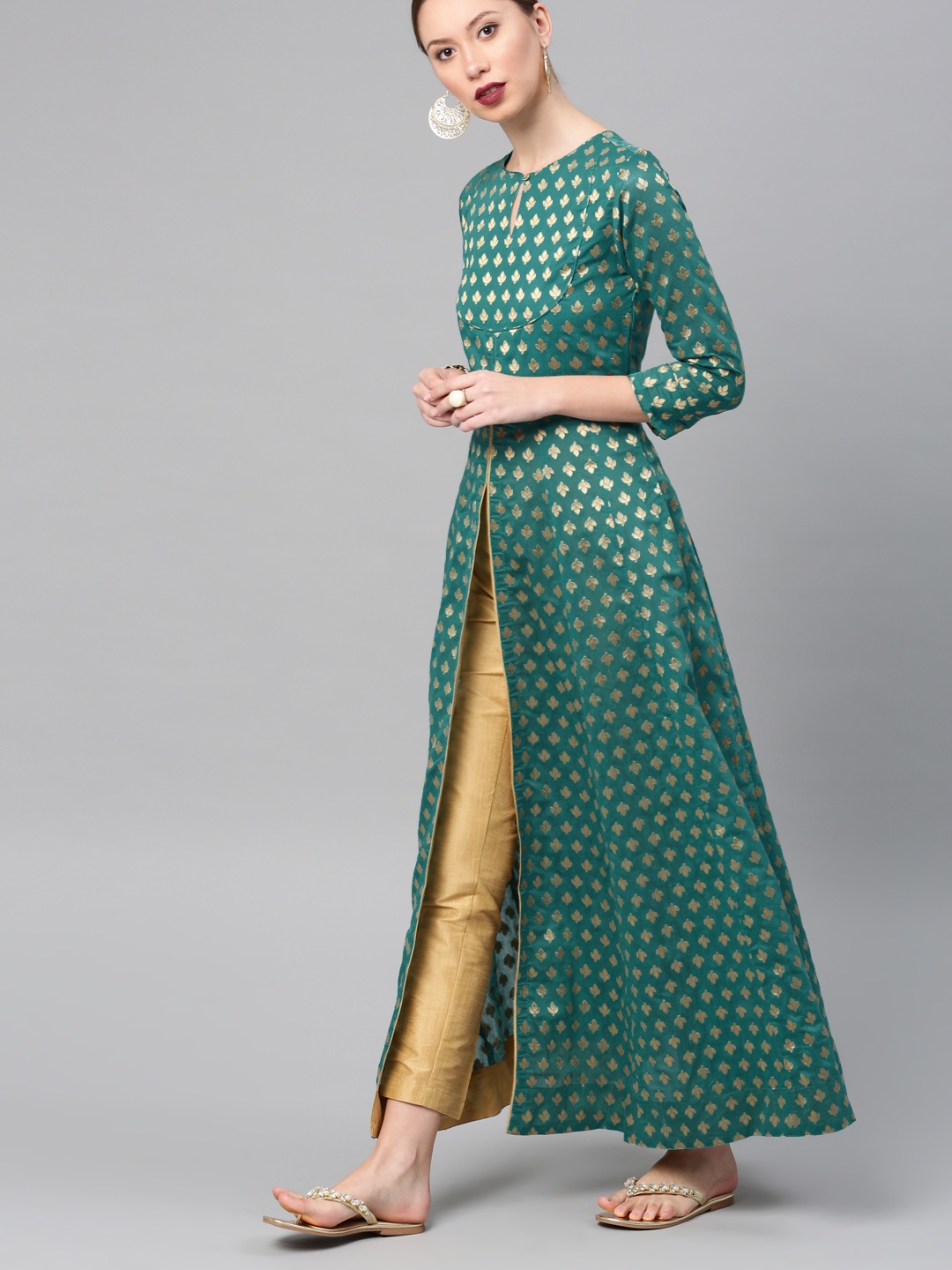 

Vishudh Women Teal & Gold-Toned Self Design Kurta with Trousers