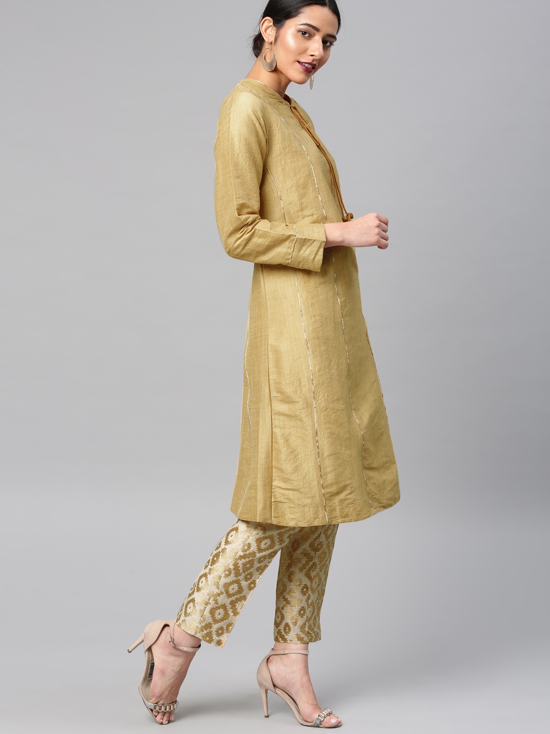 

Vishudh Women Gold-Toned & Beige Solid Kurta with Trousers