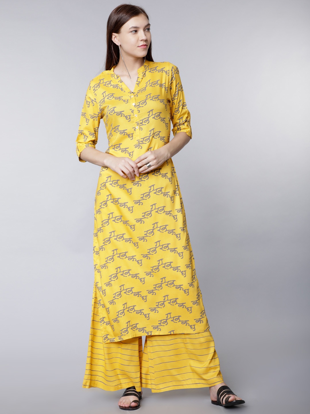 

Vishudh Women Yellow & Grey Printed Kurti with Palazzos