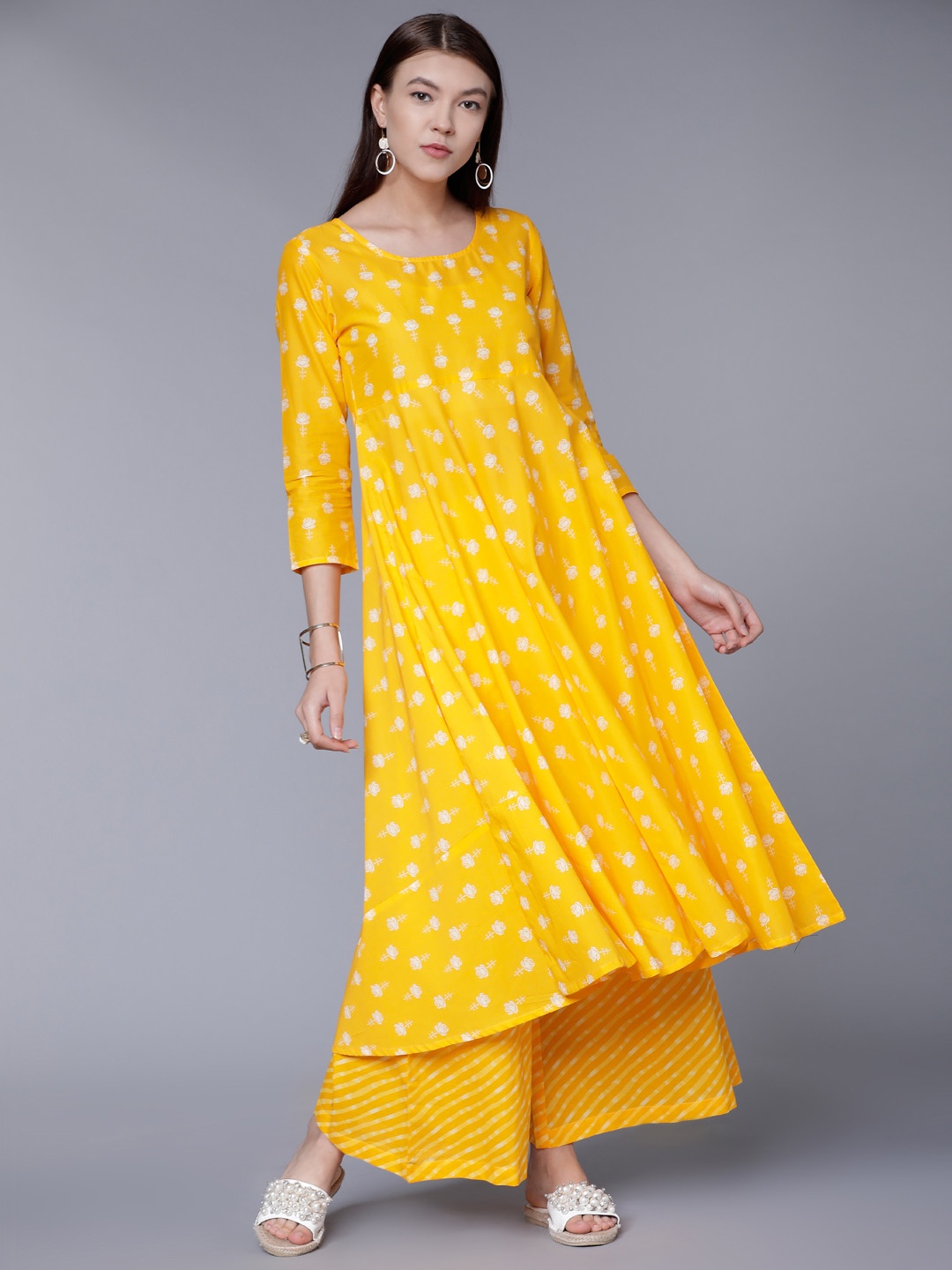 

Vishudh Women Yellow Printed Kurta with Palazzos
