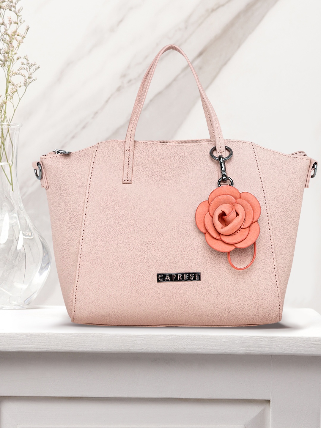 

Caprese Peach-Coloured Solid Handheld Bag