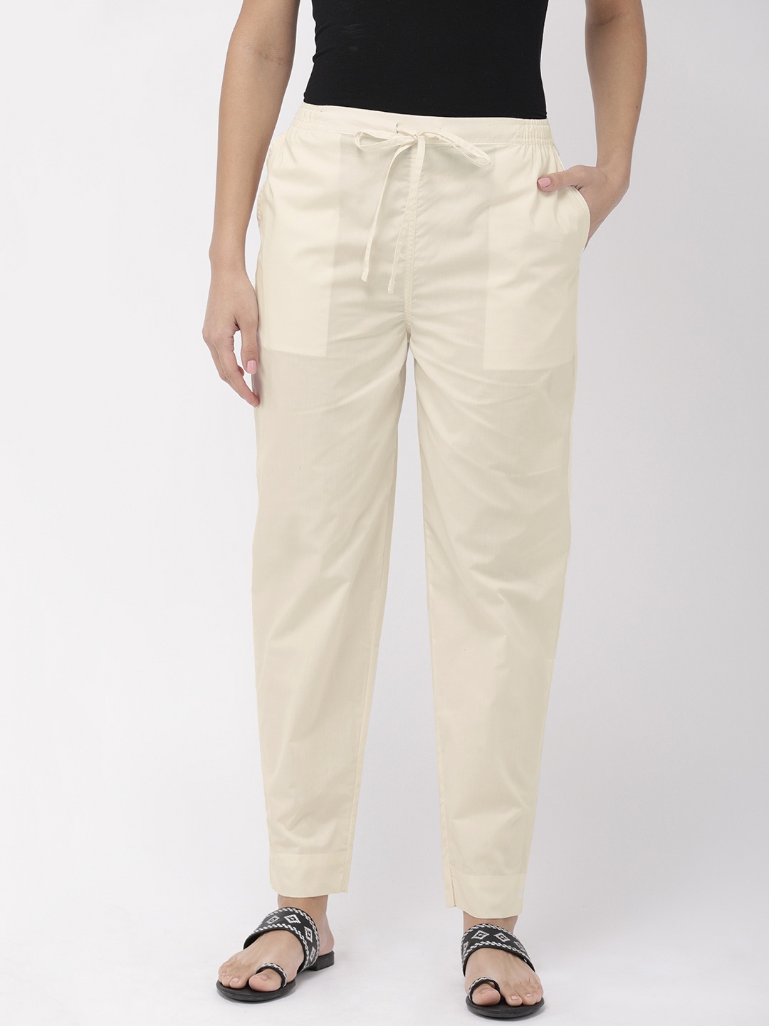 

Go Colors Women Cream-Coloured Regular Fit Solid Cotton Trousers