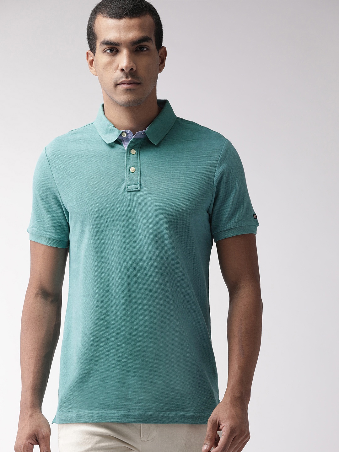 

Arrow Sport Men Green Solid Polo Collar T-shirt