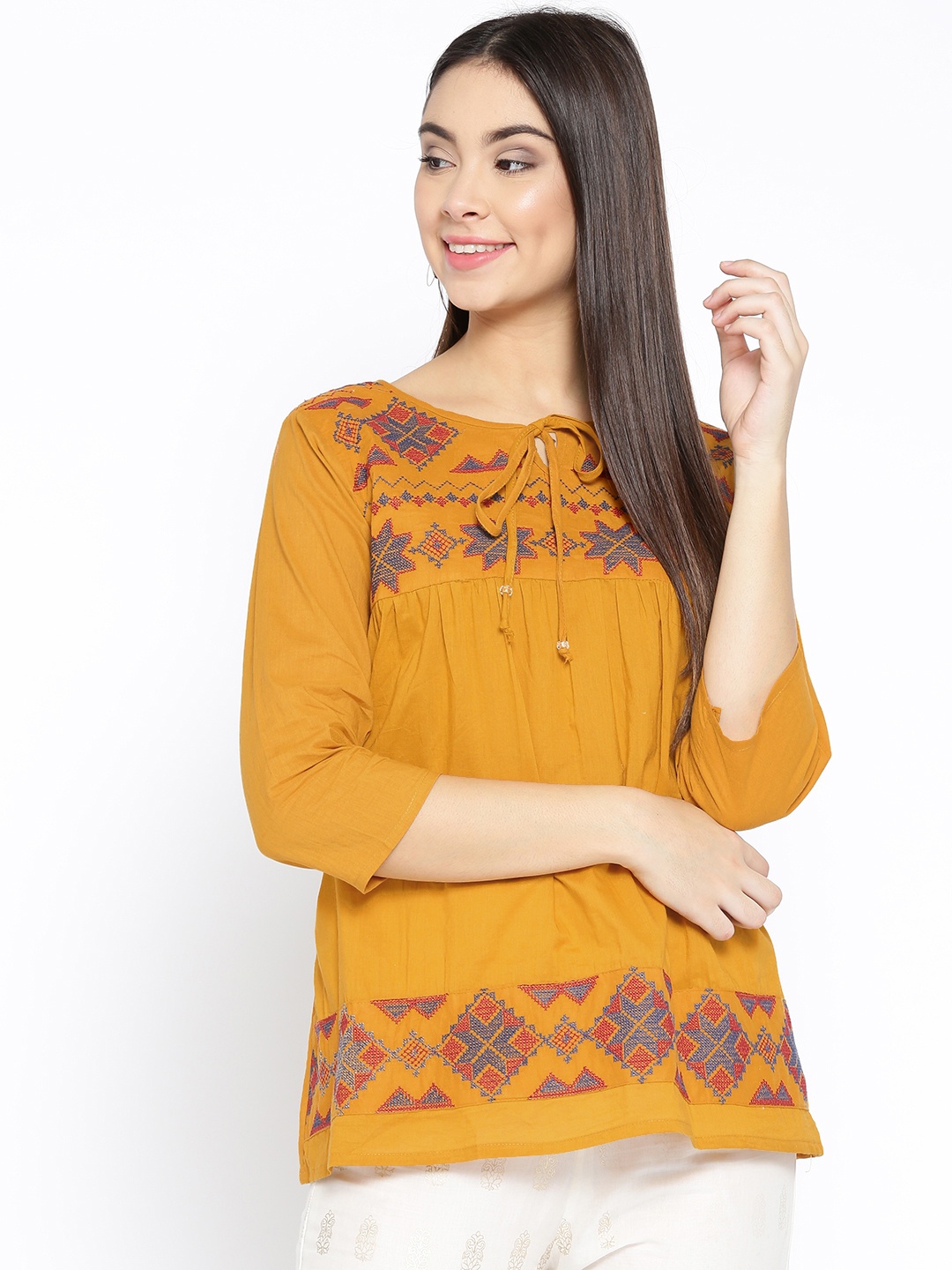 

Bhama Couture Women Mustard Yellow Embroidered A-Line Pure Cotton Top