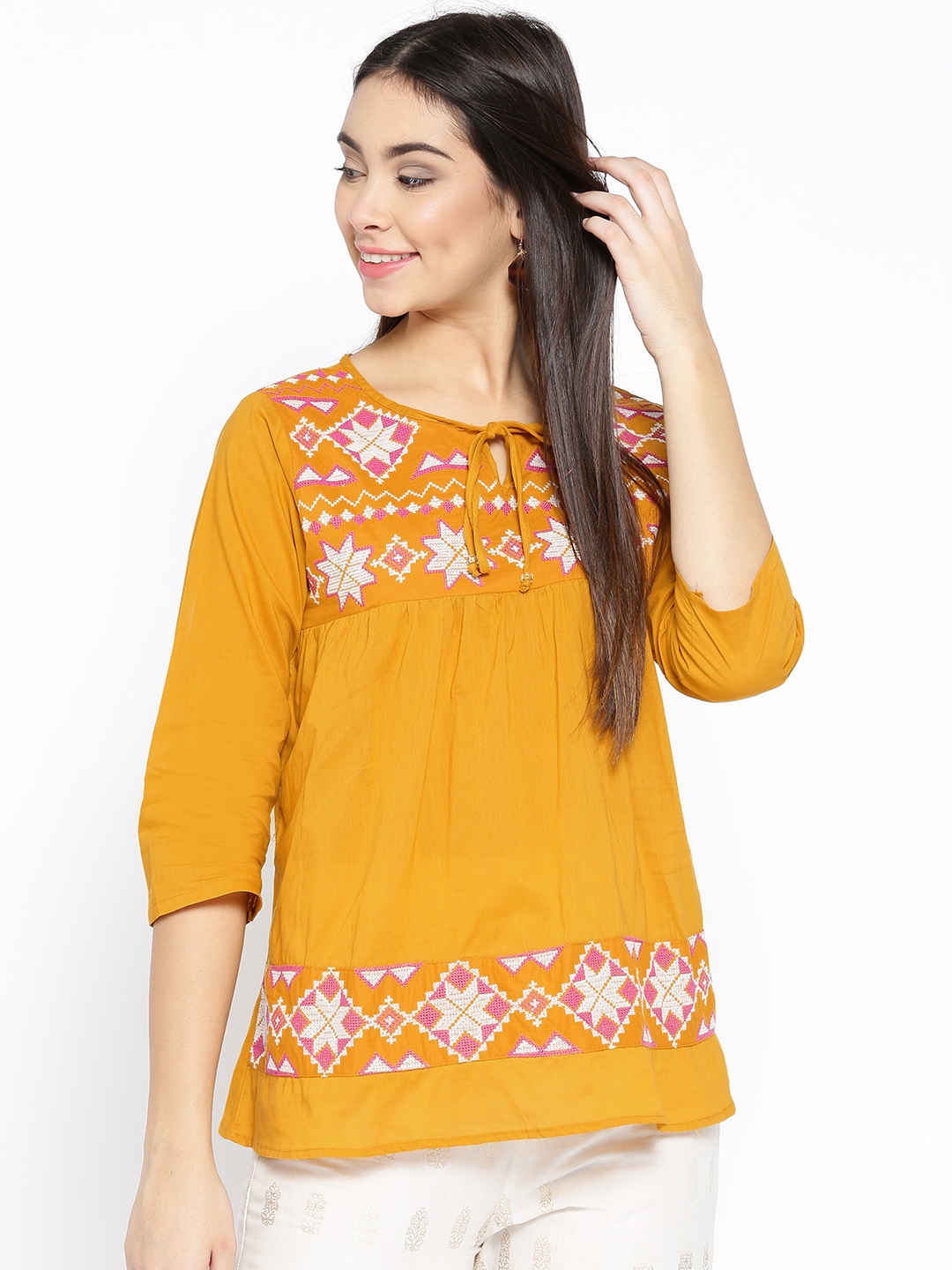 

Bhama Couture Women Mustard Yellow Embroidered A-Line Pure Cotton Top