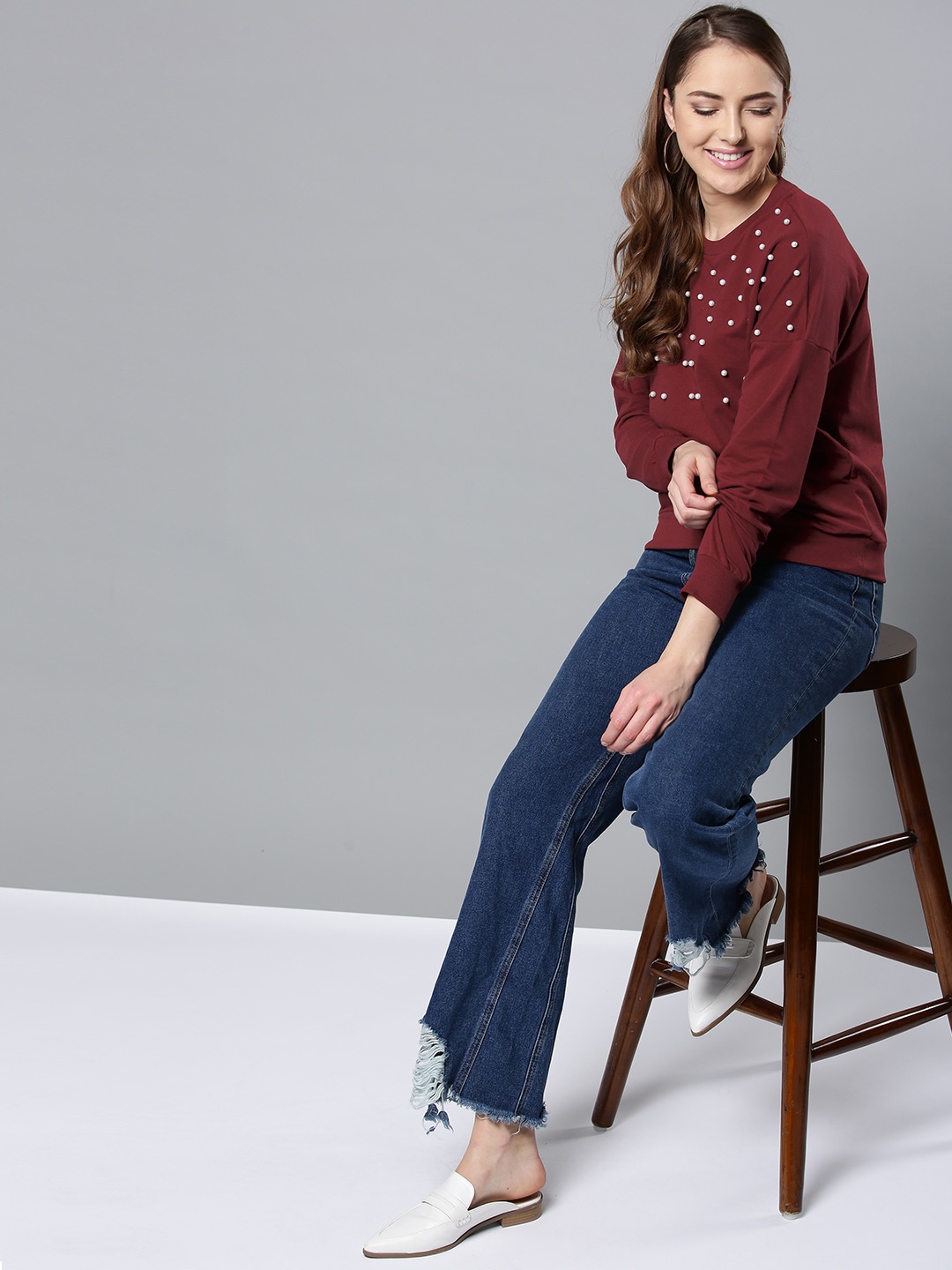 

Harpa Women Maroon Solid Sweatshirt with Embellished Detail