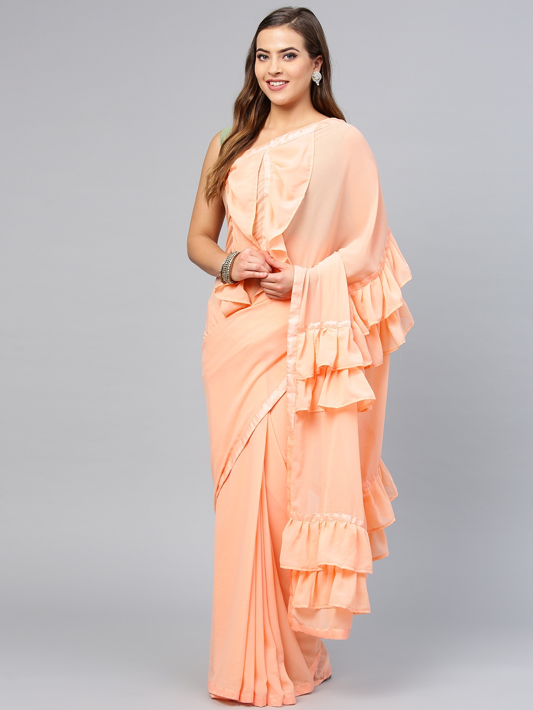 

Saree mall Peach-Coloured Solid Saree with Ruffled Detail