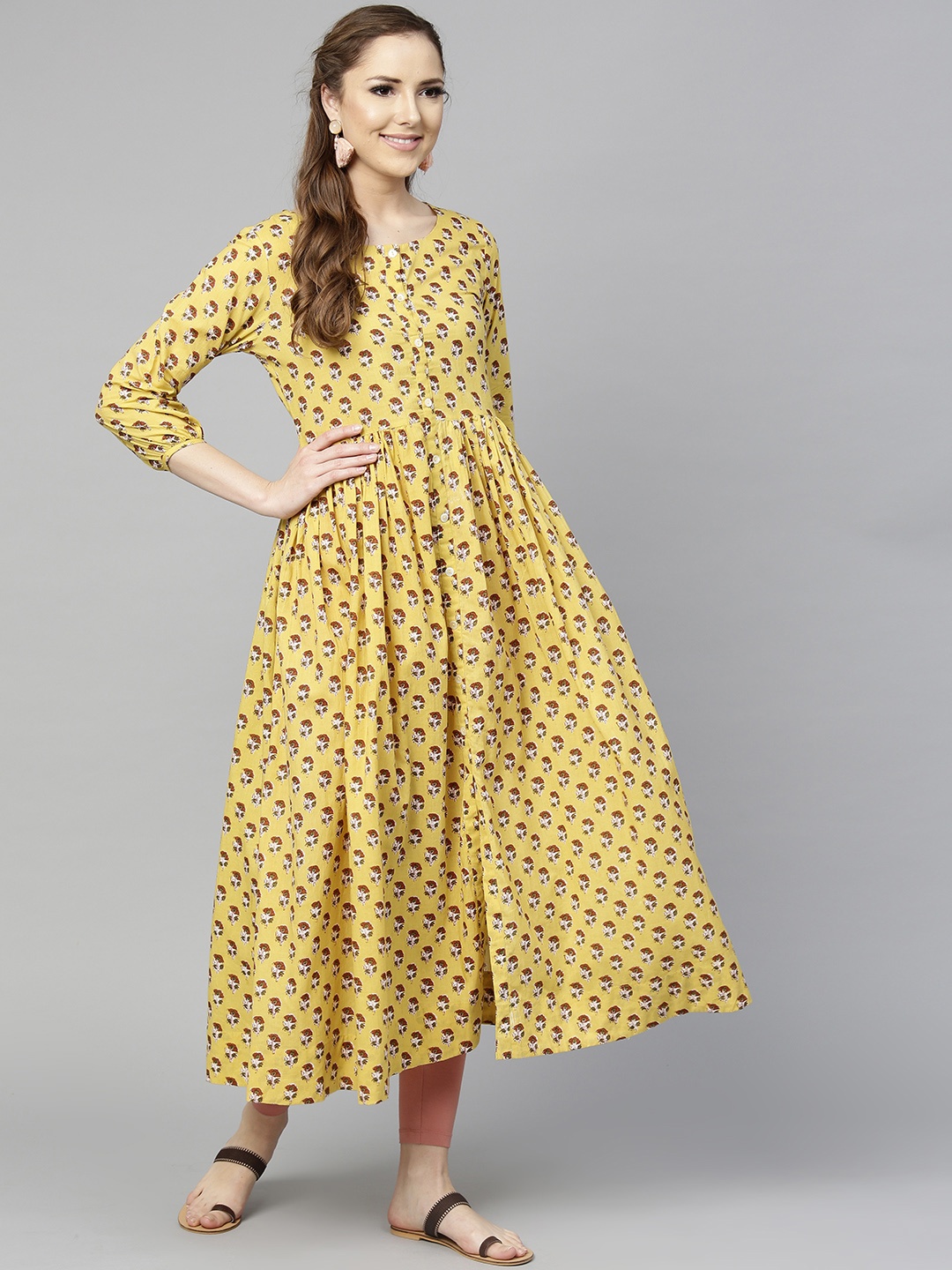 

Varanga Women Yellow & Rust Brown Screen Print Empire Kurta