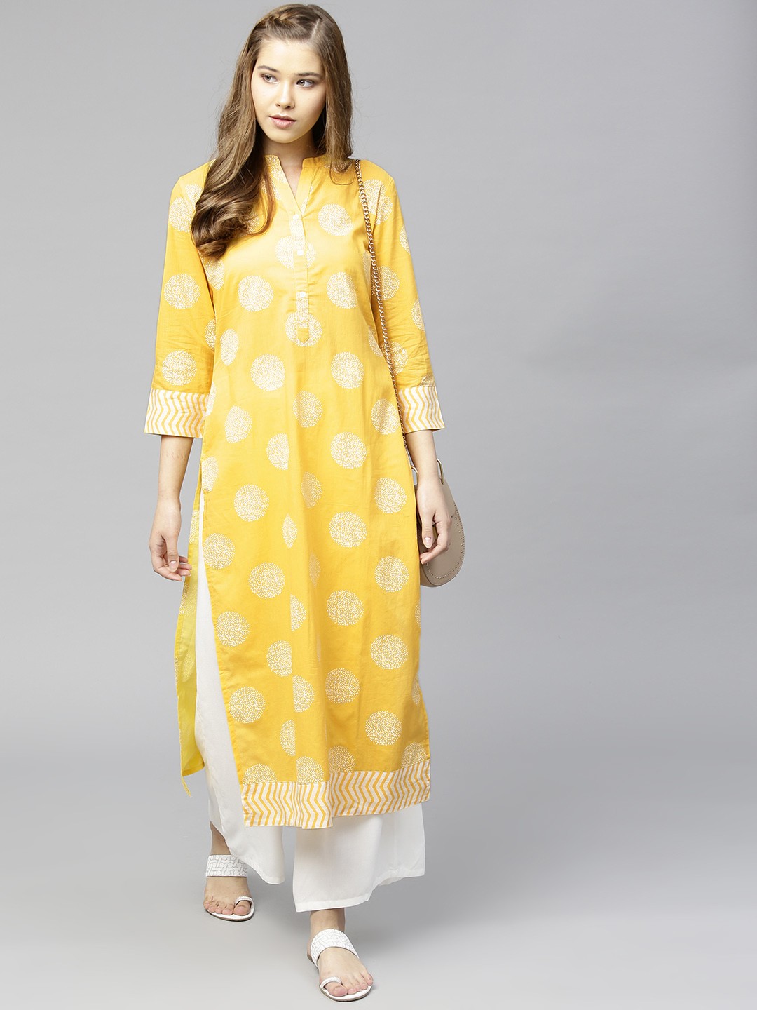 

Varanga Women Yellow & White Printed Straight Kurta