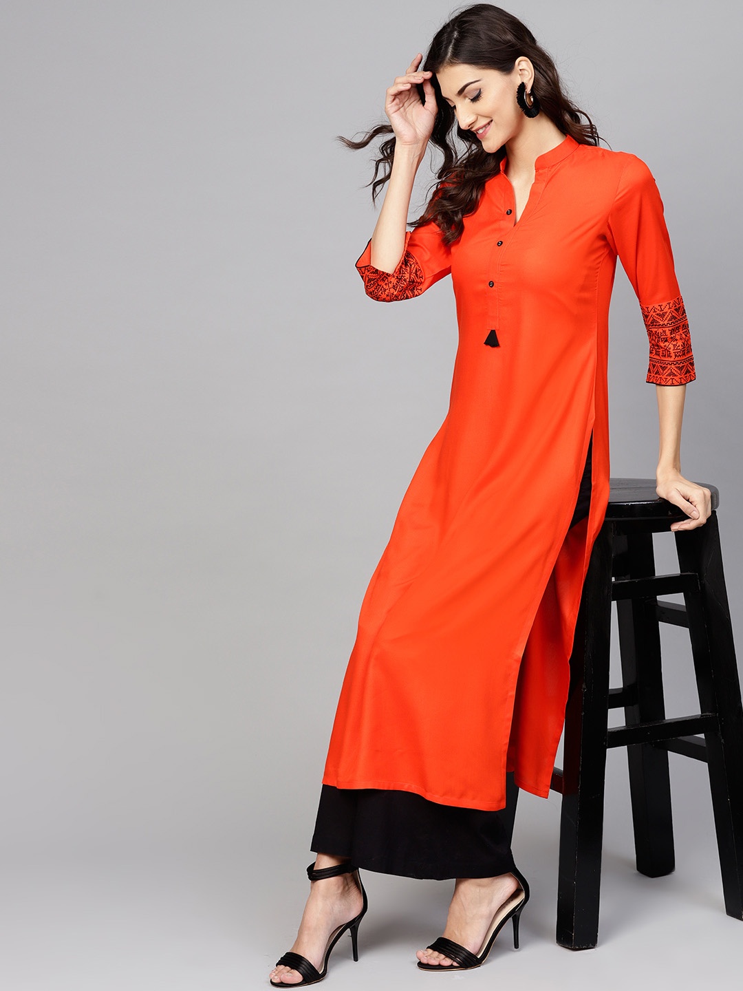 

Libas Women Orange Solid Straight Kurta