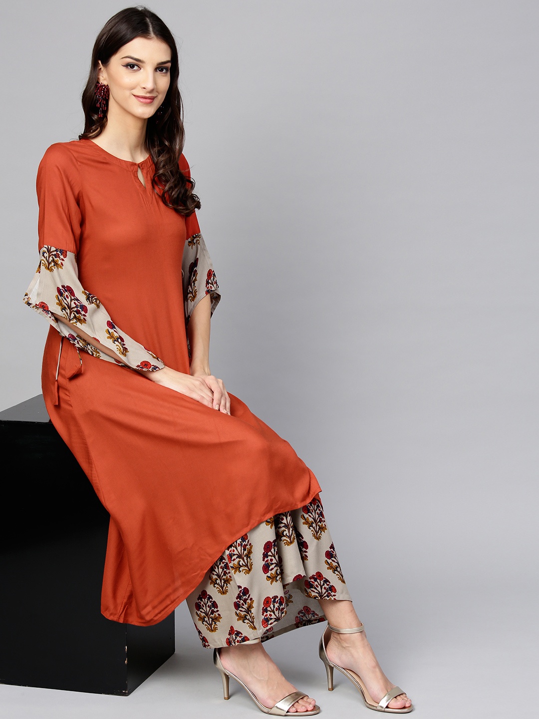 

Libas Women Rust Orange & Grey Solid Kurta with Palazzos