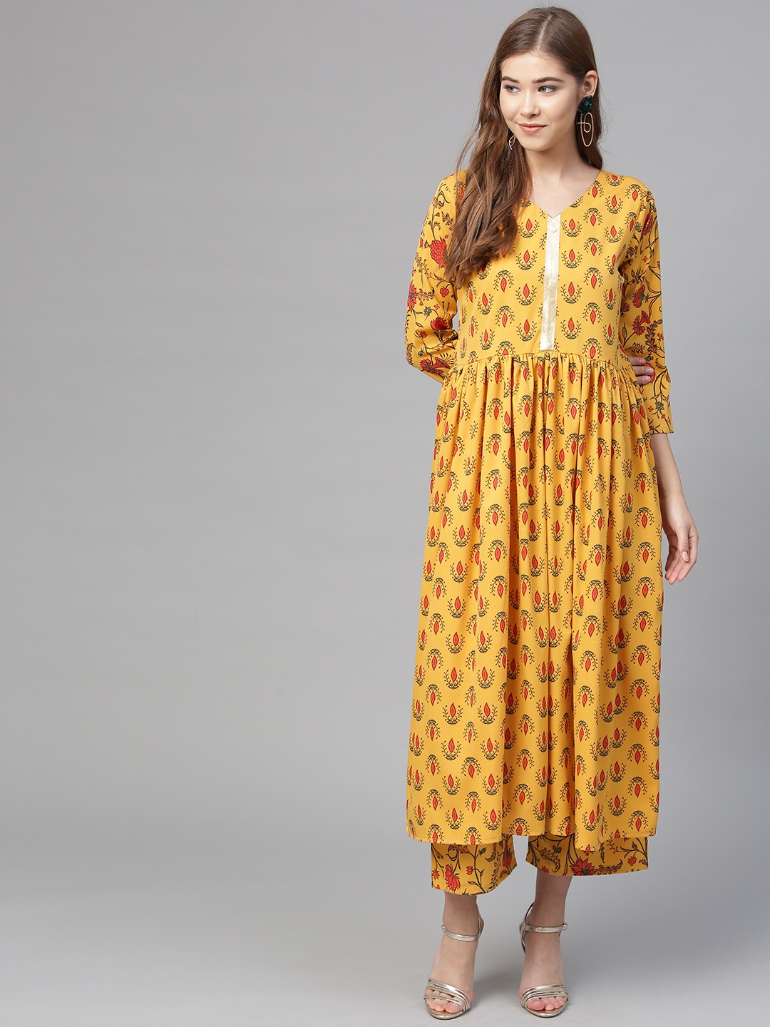 

Ahalyaa Women Yellow & Rust Orange Printed Kurta with Palazzos