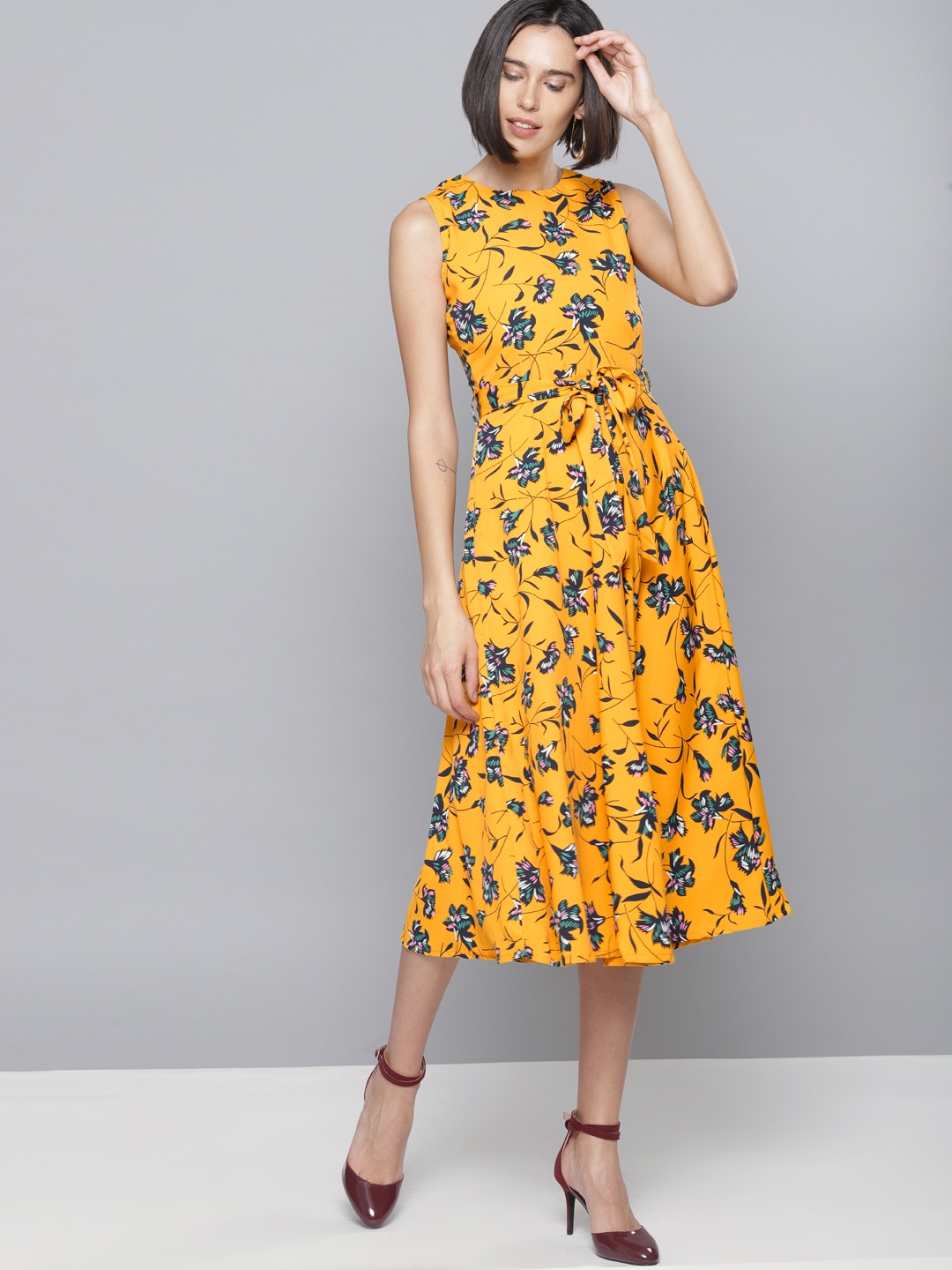 

Tokyo Talkies Women Yellow Printed Fit and Flare Dress