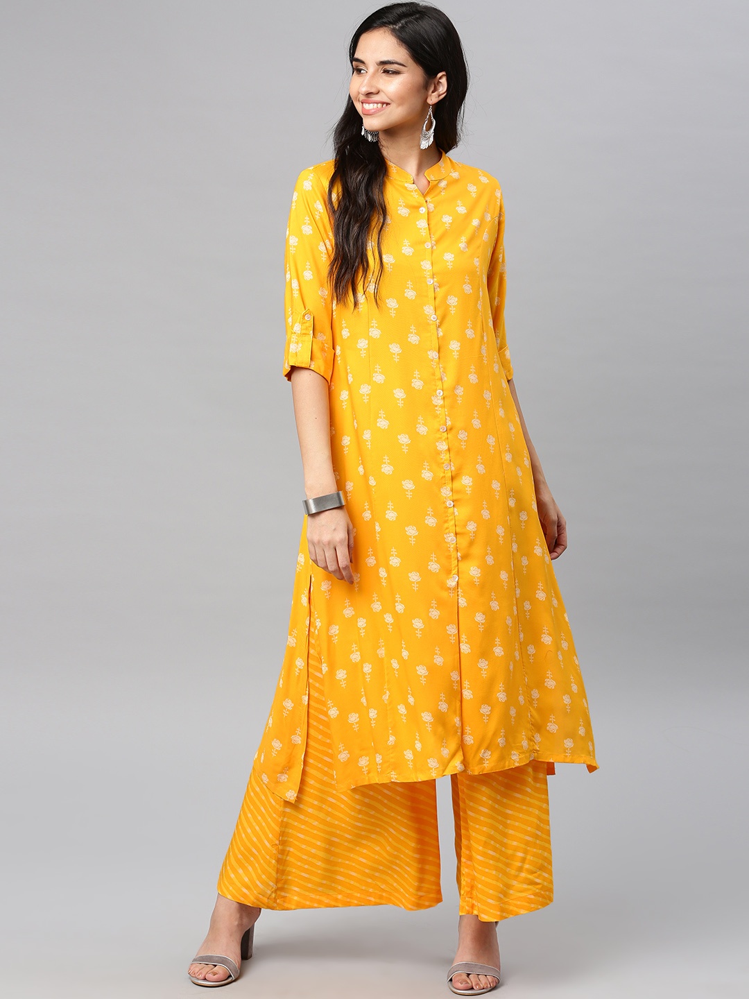 

Vishudh Women Yellow Printed Kurta with Palazzos
