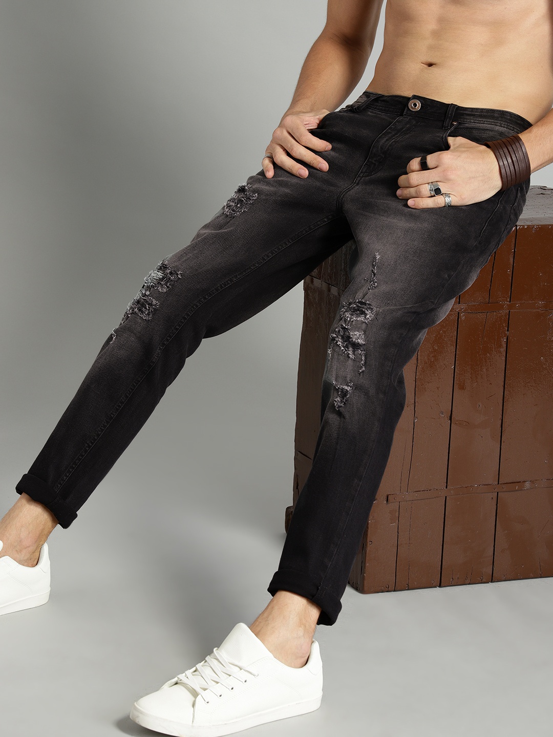 

Roadster Men Black Premium Highly Distressed Skinny Fit Mid-Rise Stretchable Jeans