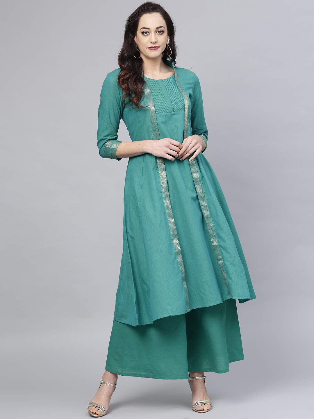 

Bhama Couture Women Green Solid Kurta with Palazzos