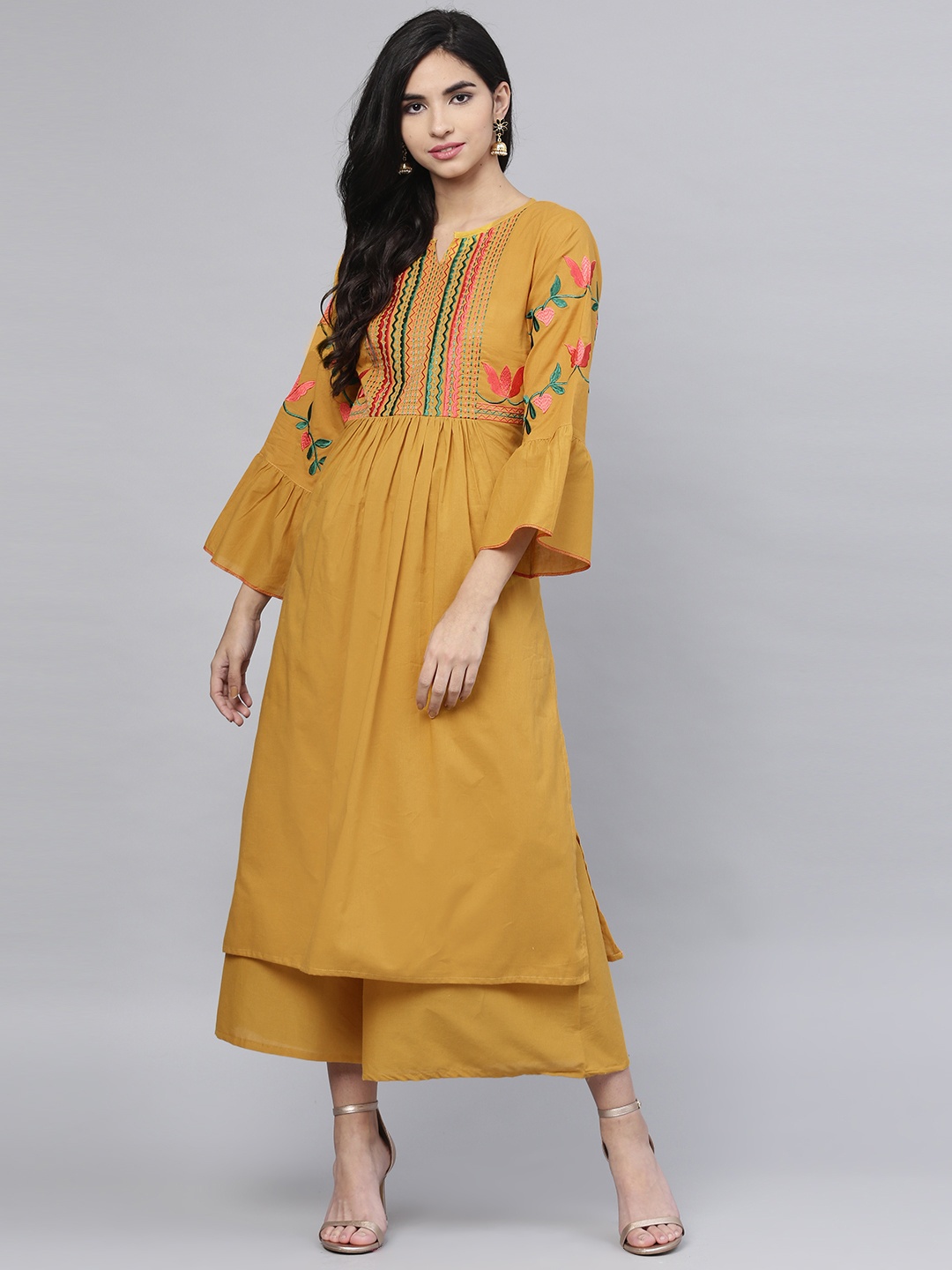 

Bhama Couture Women Mustard Yellow Yoke Design Kurta with Palazzos