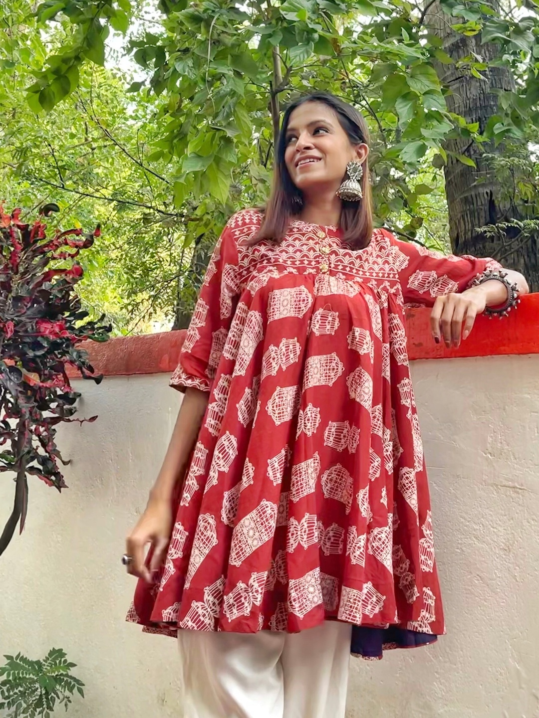 

Sangria Rust Red Ethnic Motifs Flared A-Line Pure Cotton Top