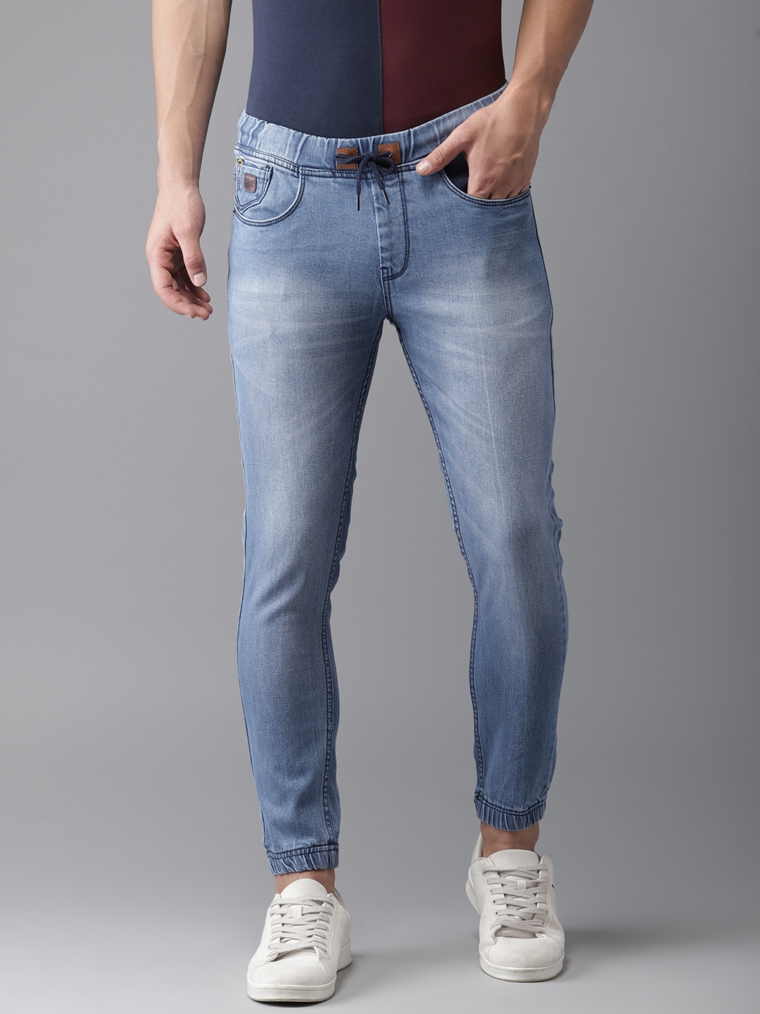 

Campus Sutra Men Blue Jogger Fit Mid-Rise Clean Look Stretchable Jeans