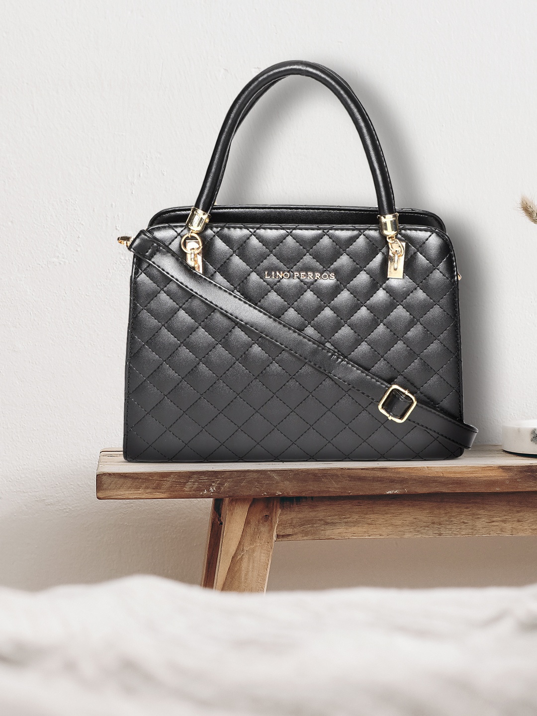 

Lino Perros Black Quilted Solid Handheld Bag