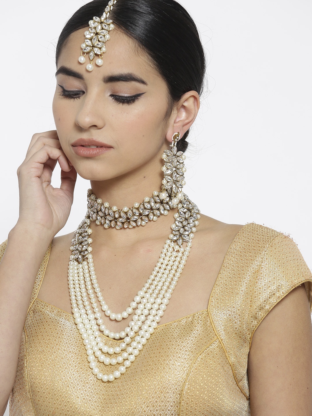 

YouBella Antique Gold-Toned & Off-White Stone-Studded Layered Jewellery Set