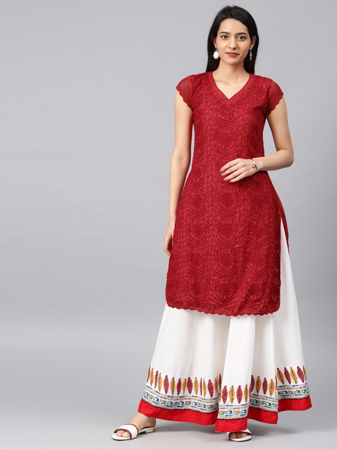 

Saadgi Women Red Embroidered Straight Kurta